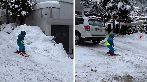 Kid goes skiing down his driveway