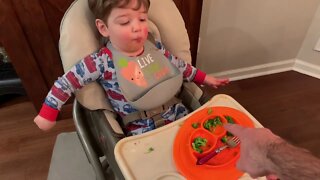 Grant eating broccoli
