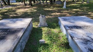 Infants Grave Rests Between Parents