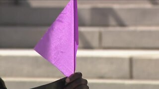 Dozens march in Denver to remember victims, survivors of domestic violence