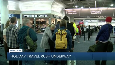 Locals head the airport for holiday travel Wednesday