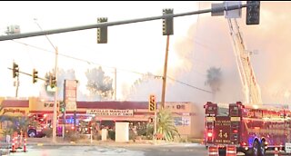 Firefighters battle 2-alarm fire at market in northwest Las Vegas