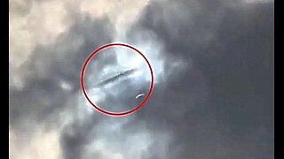 UFO sighted above Arlington, Texas during solar eclipse, it appears to vanish into clouds