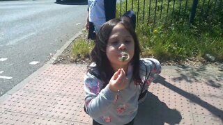 Cute girls blowing dandelions