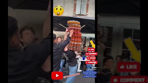 Hilarious Waiter Mishap: 100 Beers Spilled as Tower of Trays Wobbles!
