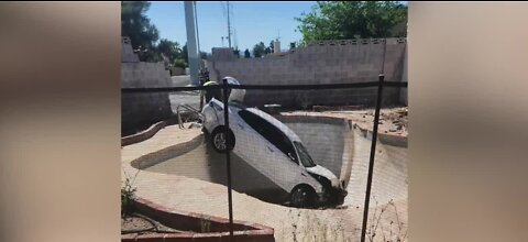 Car crashes into wall, empty pool of southeast Las Vegas residence, police say