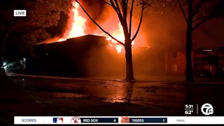 Crews continue to battle massive apartment fire in Westland