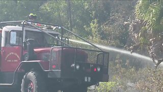 Crews battle brush fire near Englewood