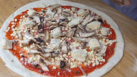 Italian Pizza from Naples in a Wood Fired Oven, London Street Food. Blue Cheese and Mushrooms
