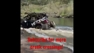 Small SUV almost sinks in flooded creek! #shorts