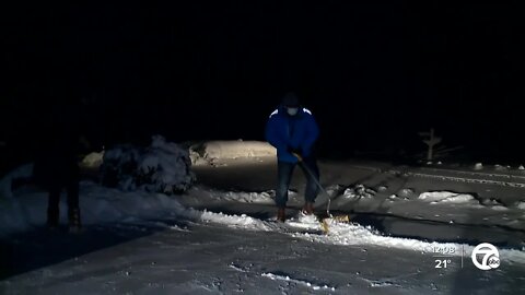 keenan helps woman shovel