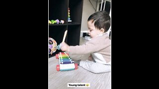 Baby playing xylophone