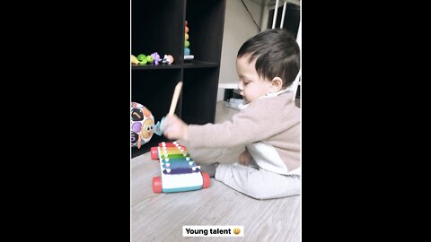 Baby playing xylophone