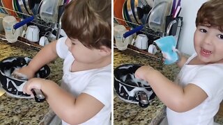 Helpful Baby Assists Mom With The Dishes