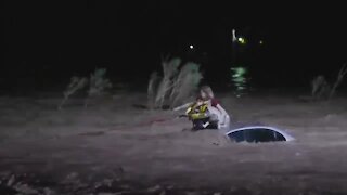 Woman, dog rescued in from flooded wash near Camino de la Tierra and River