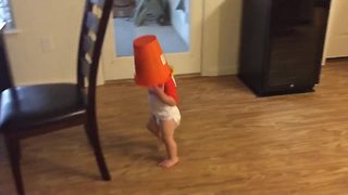Toddler Runs Around The House With A Bucket On His Head
