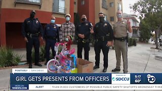 Girl gets presents from CHP officers