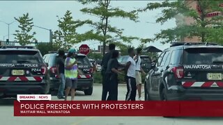 Police presence with protesters at Mayfair Mall