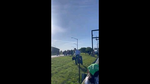 Leftist protestors blocking road to O'Hare Airport, people walking on for to catch flights.