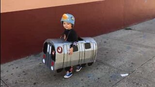 Little boy dresses up as a subway train for Halloween