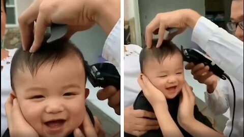 Baby can't stop laughing when cutting her hair
