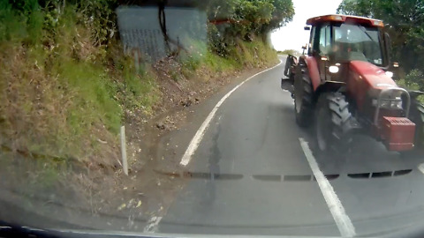 Car Has A Near Miss With Tractor On Narrow Hill Road
