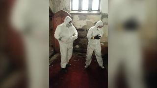 Two Guys In Hazmat Suits Dance To “Happy”