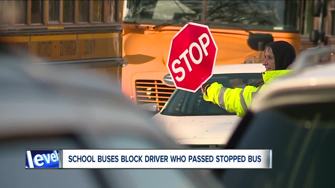 2 bus drivers box in vehicle that passed a stopped school bus, nearly hitting a child and crossing guard