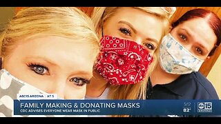 Family making and donating masks