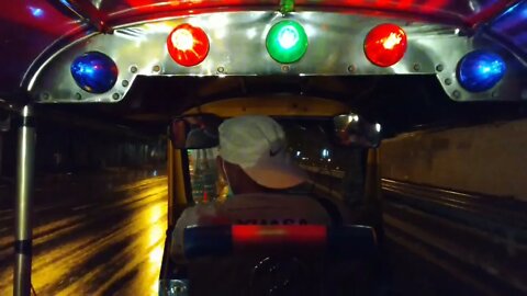 Tuk-tuk ride on a rainy night in Bangkok Thailand 2022