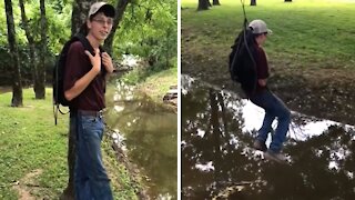 Epic Fail: Kid Swinging From Backpack Falls Into Creek