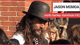 Jason Momoa very enthusiastically greeting workers at the Harley-Davidson HQ