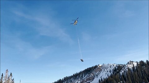 U.S. Army Chinook Sling Loads Black Hawk Helicopter