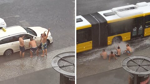 Guys in Berlin turn flooded streets into personal vacation