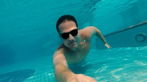 Underwater challenge in pool.