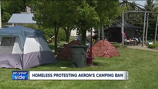 Akron homeless protest camping ban by pitching tent in public spaces