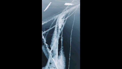 Big cracks across a frozen lake