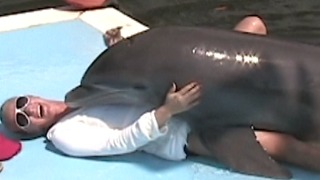 Dolphin Gets A Little TOO Friendly with Woman