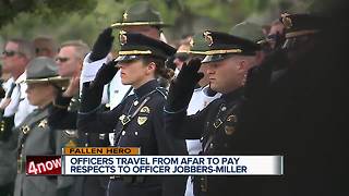Hundreds pay respects at officer's funeral