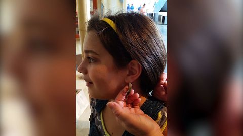 Girl Gets A Lizard Earring