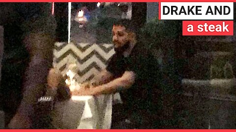 Drake spotted with a mystery woman