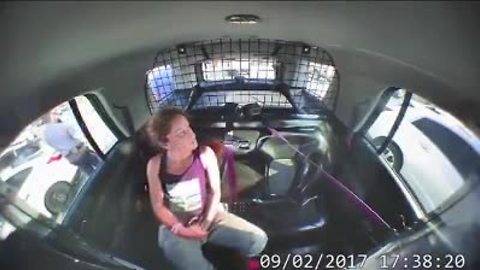 Watch as a Texas woman breaks out of handcuffs, steals police car