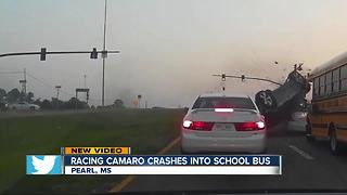 Speeding sports car crashes into school bus