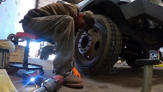 Removing broken exhaust manifold bolts .
