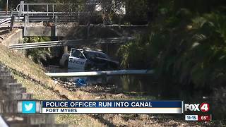 Police Officer Run into Canal