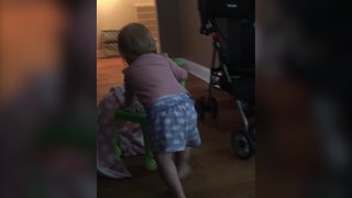 Cute Tot Girl Flips Over A Little Chair