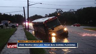 Police rescue students, adults from flooded bus