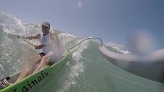 One man outrigger surfing