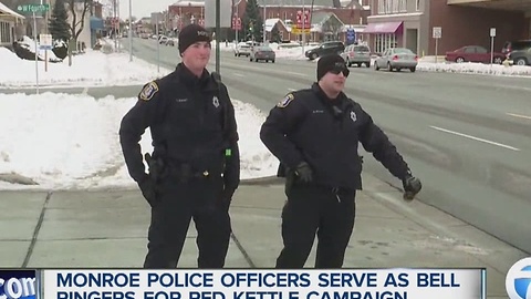 Monroe police officers serve as bell ringers for Salvation Army Red Kettle campaign