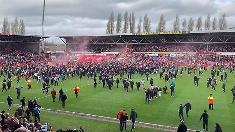 Wrexham Fans storm the Pitch after Promotion to League 1